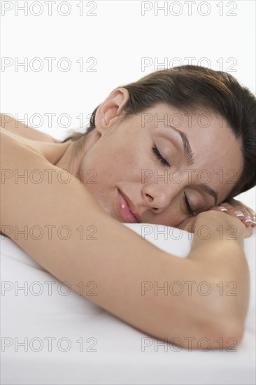 Closeup of woman on massage table.