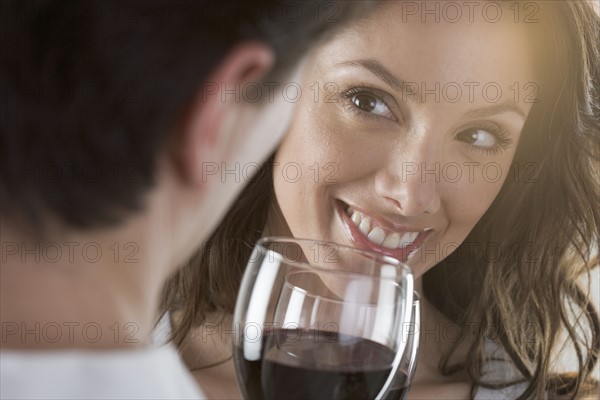 Couple holding wine glasses.