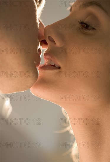 Closeup of couple kissing.