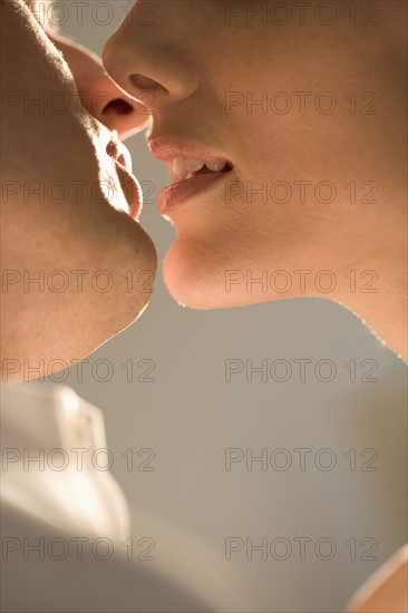 Closeup of couple kissing.