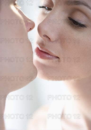 Closeup of couple kissing.