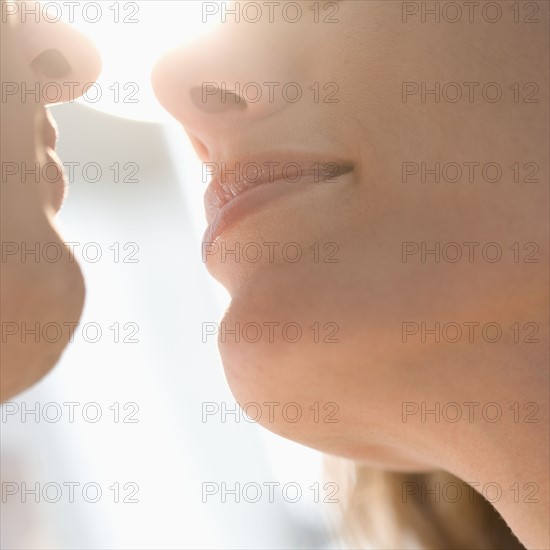 Closeup from below of couple kissing.