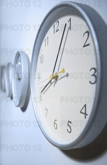 Closeup of clock on wall.