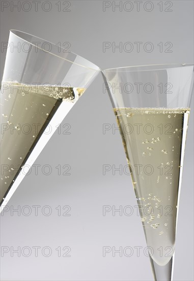 Toasting with champagne glasses.