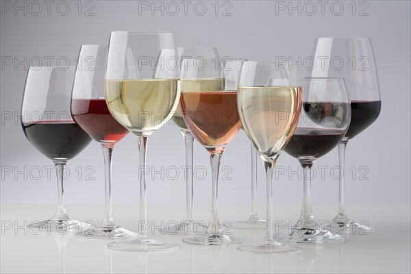 Closeup of glasses of different wines.