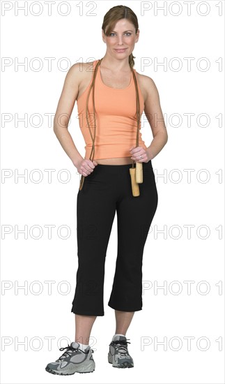 Young woman preparing to jump rope.