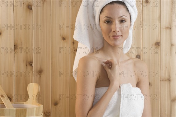 Smiling woman in sauna.