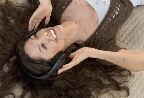 Closeup of woman with headphones on.