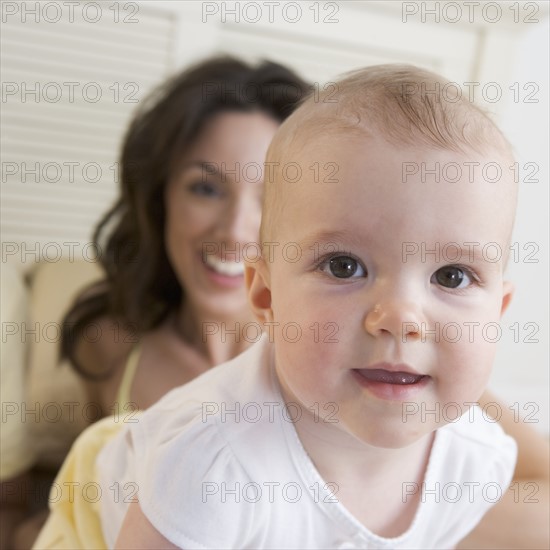 Closeup of baby with mother.