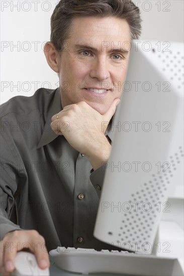 Businessman working at computer.
