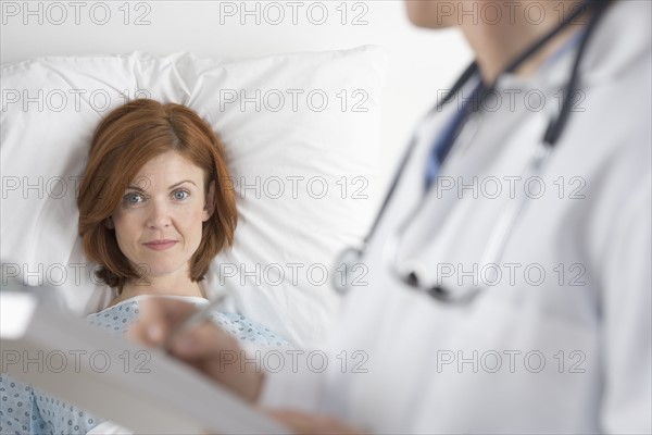 Patient with doctor and chart.