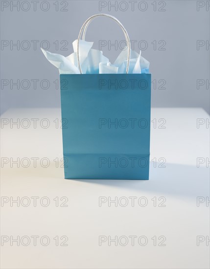 Blue gift bag with tissue paper.