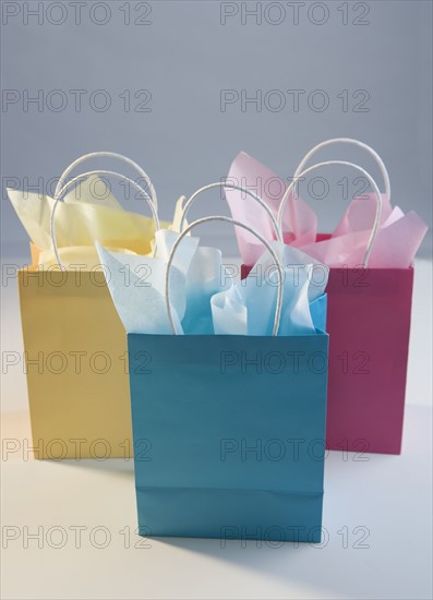 Colorful gift bags with tissue paper.