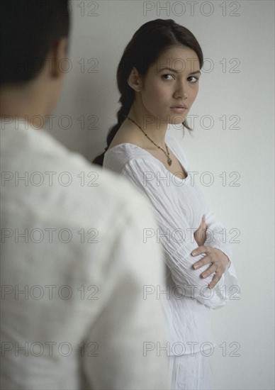 Unhappy woman looking at a man.