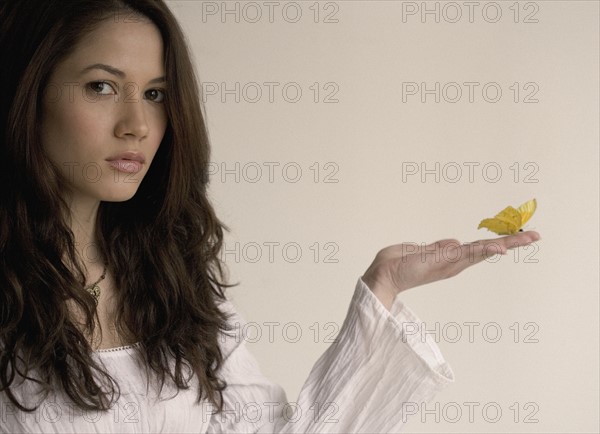 Portrait of a woman with butterfly.