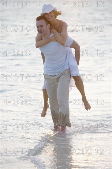 Playful couple at the beach.