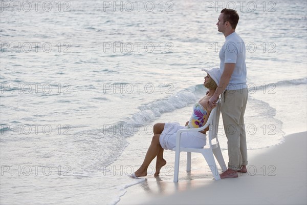 Couple relaxing at the beach.