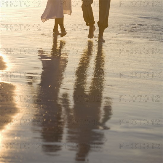 Couple strolling the beach.