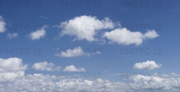 White clouds in blue sky.