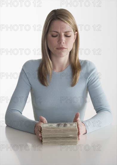 Woman with a stack of money.