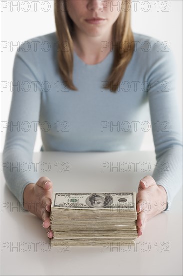 Woman with a stack of money.