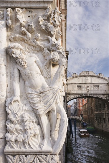 The Bridge of Sighs with sculpture depicting Drunkenness of Noah Doge's Palace Venice, Italy.