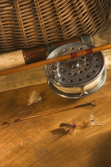 Still life of antique fishing reels.