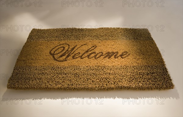 Closeup of a welcome mat.