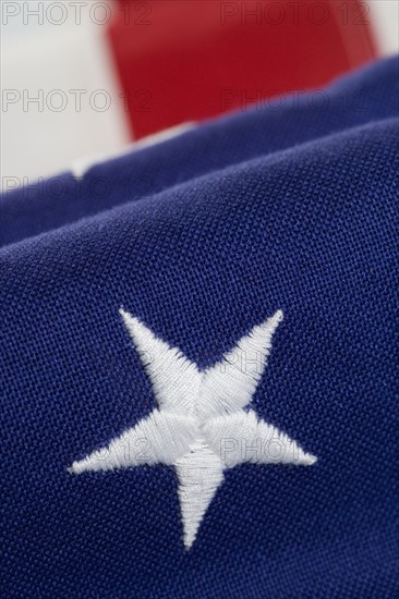 Closeup of star on American flag.