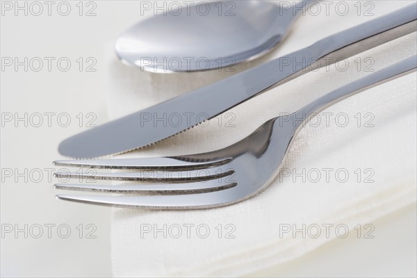 Still life of silverware and napkin.