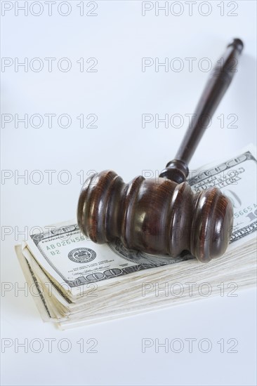 Still life of gavel and money.