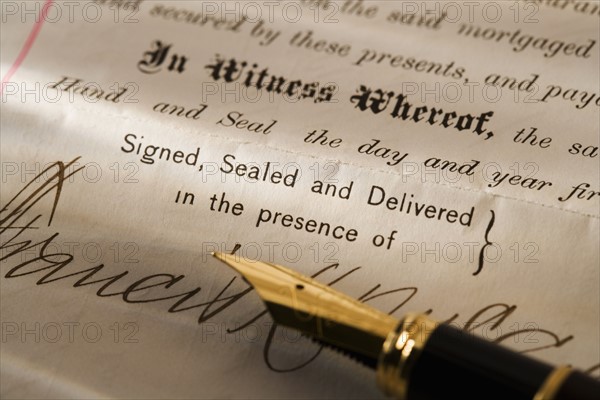Closeup of pen and contract.