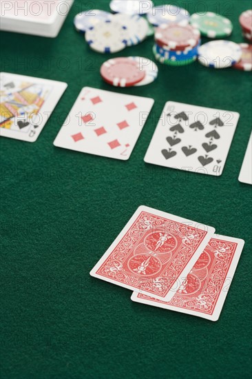 Poker hand and chips.