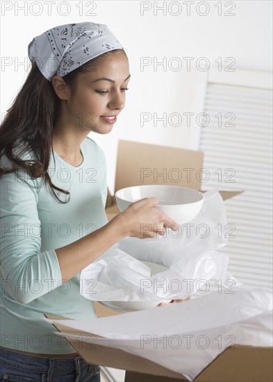 Woman with bowls and boxes.