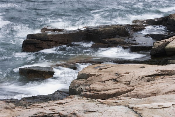 Waves breaking on the Maine coast.