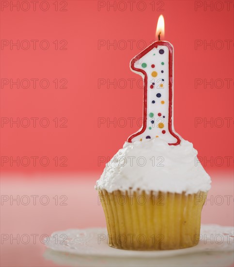 One candle on a cupcake.