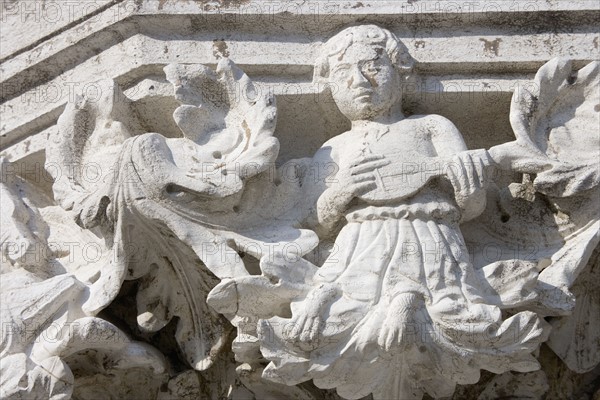 Column sculpture on Doges' Palace Venice Italy.