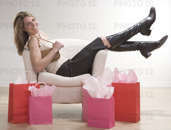Woman relaxing after shopping.