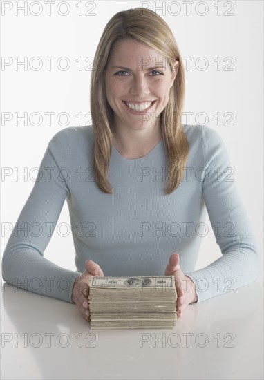 Woman with a stack of money.
