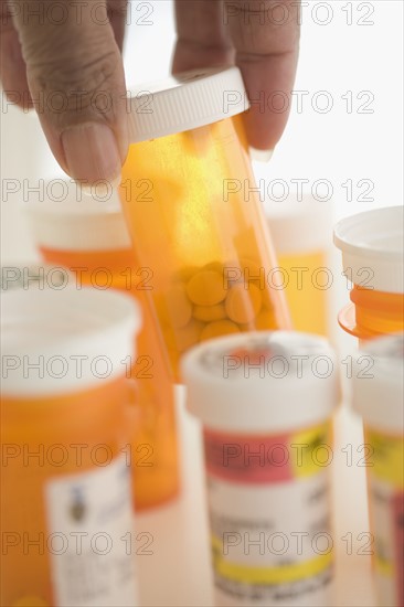 Hand selecting prescription drugs.