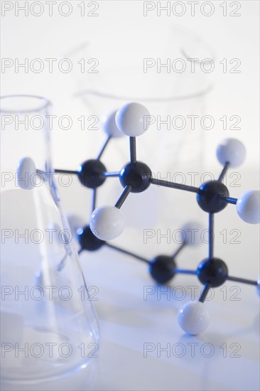 Still life of molecular structure and beakers.