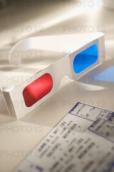 Still life of 3-D glasses and movies tickets.