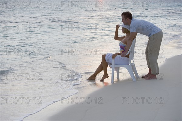 Couple relaxing at the beach.