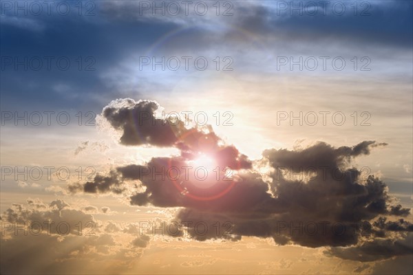 Sunset through clouds.