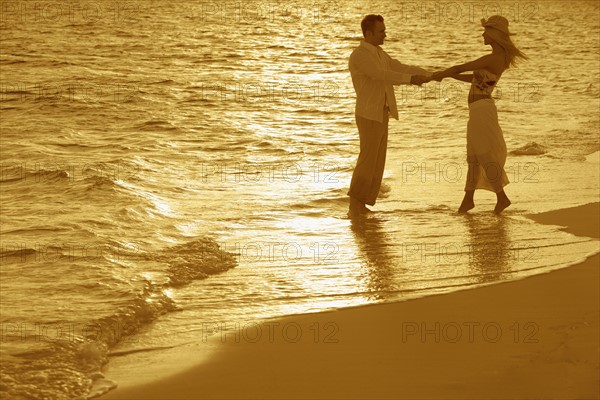 Romantic couple on beach.