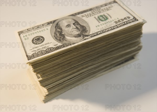 Tall stack of U.S. hundred dollar bills.