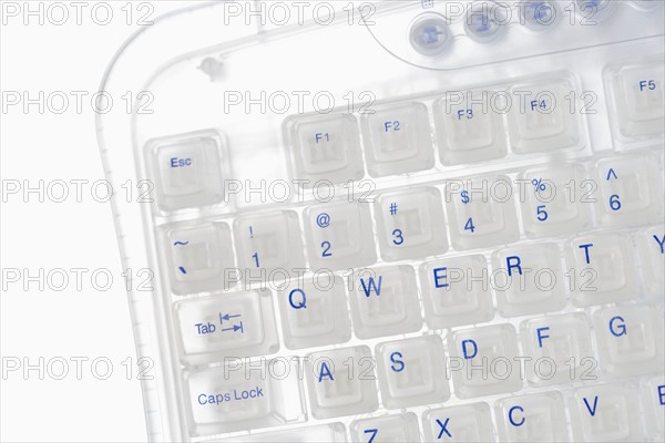 Closeup of corner of transparent keyboard.