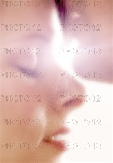 Closeup of man kissing woman's forehead.