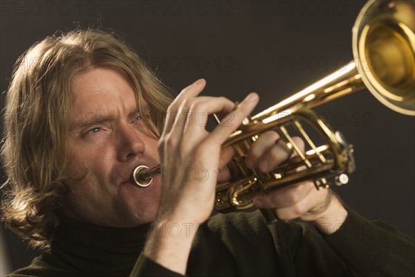 Man playing the trumpet.