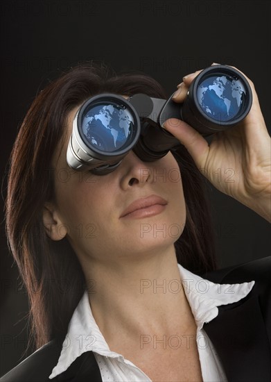 Woman looking through binoculars.